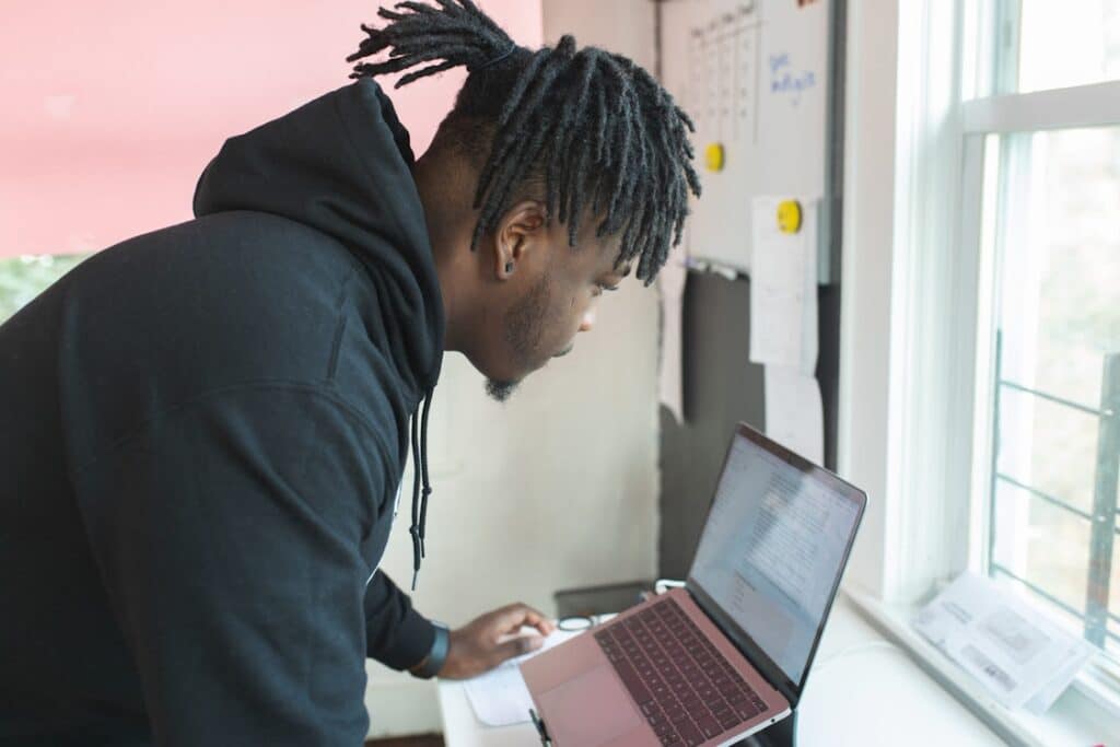 a man working on a vlog using a laptop