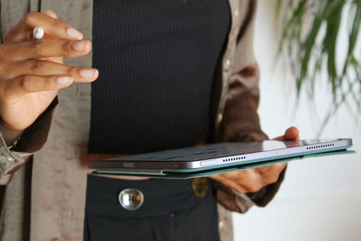 A woman holding a tablet computer in her hands