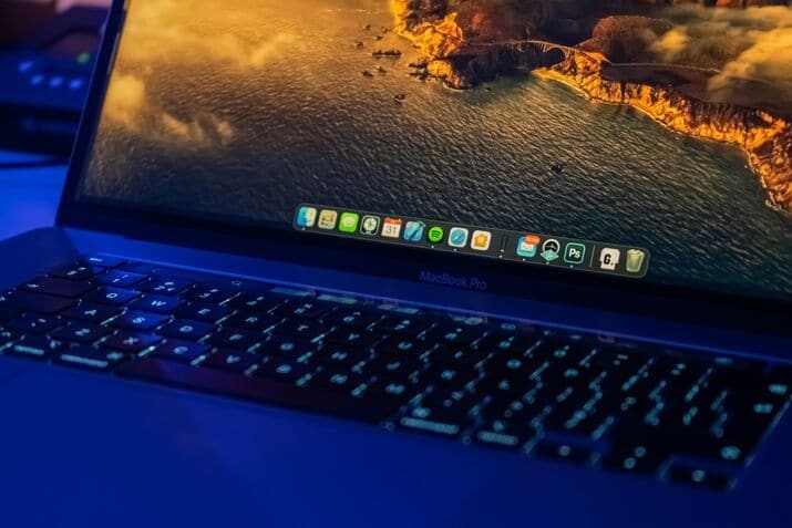 Black laptop computer turned on, displaying desktop icons