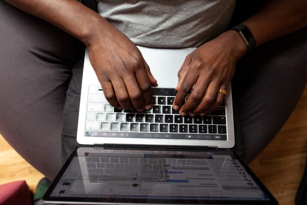 Man’s hands on a laptop keyboard