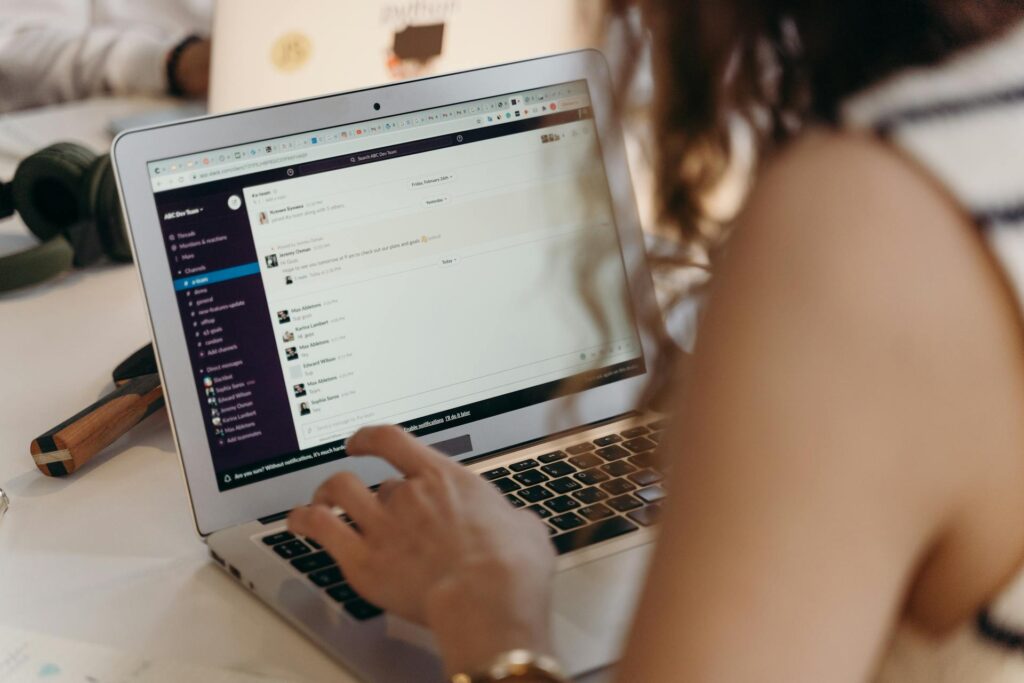 a woman sending mails on her mmacbook