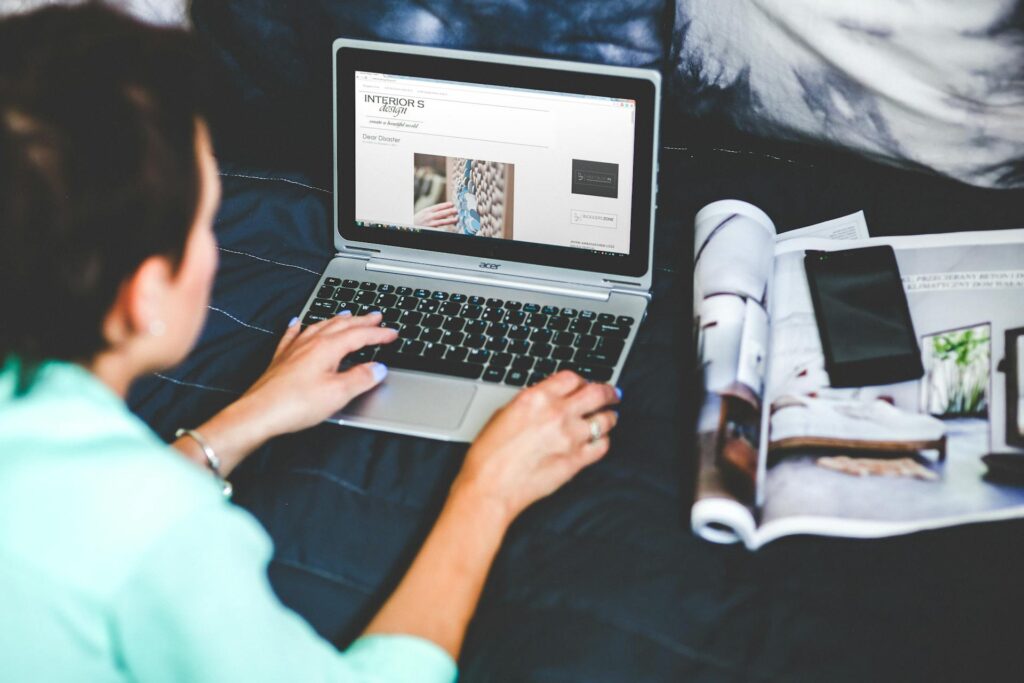 a woman designing on her laptop