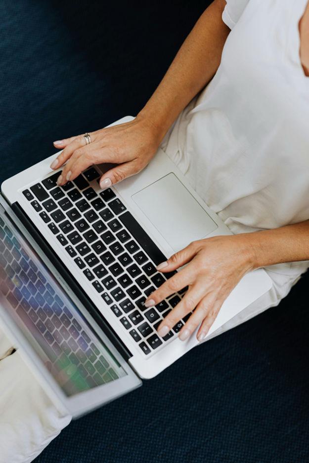 a person typing on a laptop