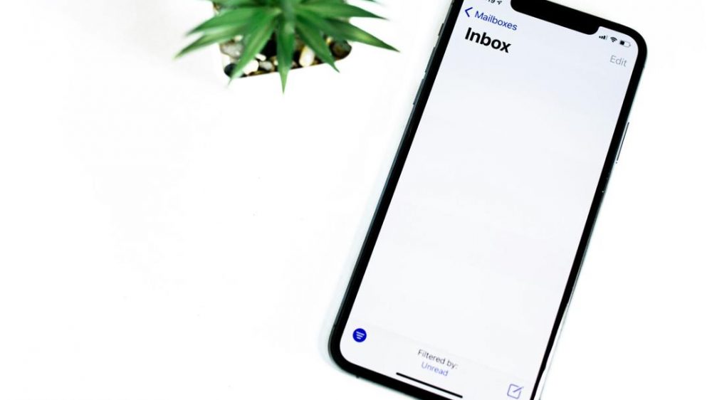 black iphone 5 on white surface
