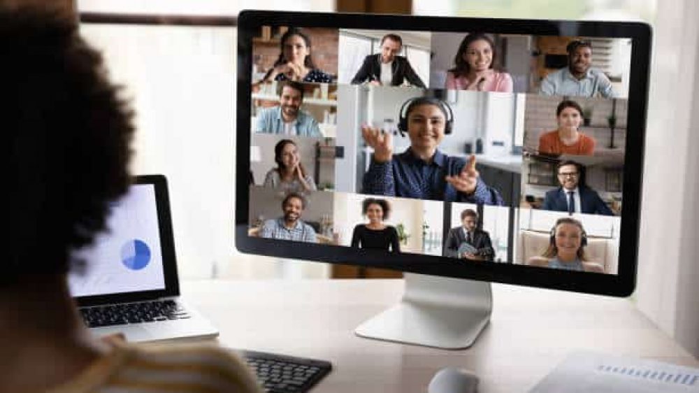 Diverse business team meeting on virtual chat, discussing project on video conference call. African manager attending partnership online briefing, working at computer monitor. Screen with video call